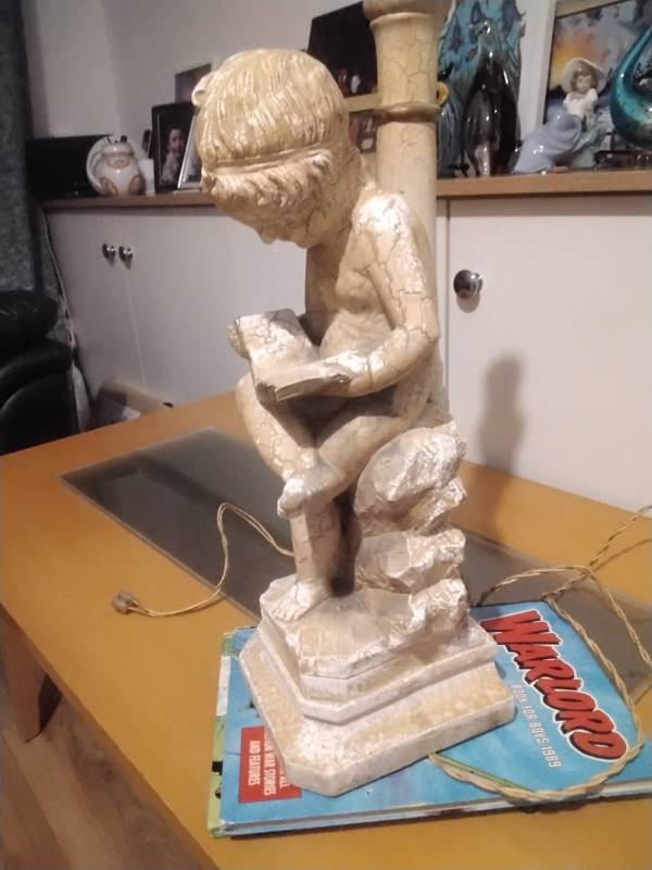 Statue of boy.